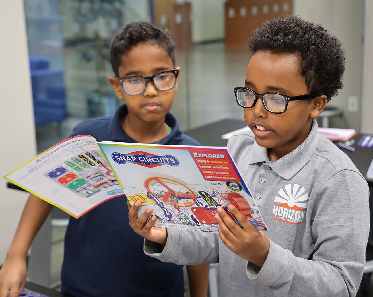 Teacher or school staff member warmly interacting with a student outside